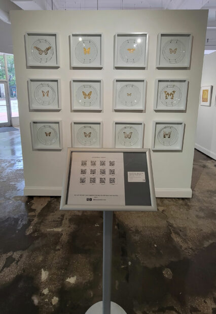 Installation view of works on paper on a grid
