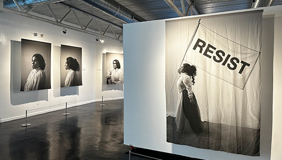 Installation view of black and white portraits