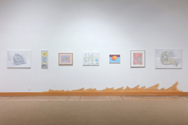 Installation view of paintings and works on paper in a row on the wall