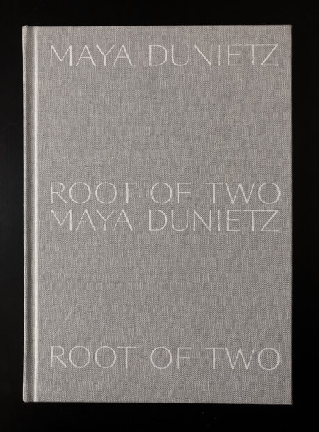 A photo of a gray book cover that reads: "Maya Dunietz: Root of Two."