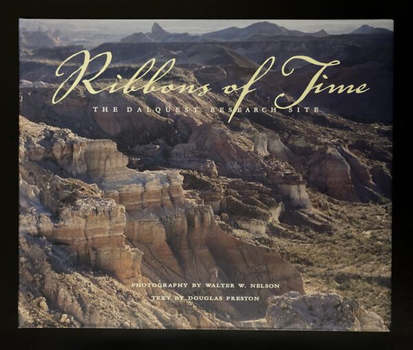 A photo of a book cover, featuring a photograph of a desert-cliff-like landscape. The cover reads "Ribbons of Time: The Dalquest Research Site, by Douglas Preston, Photography by Walter W. Nelson."