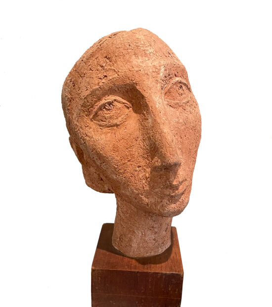 A sculpture by Charles Umlauf of a stylized depiction of a woman's head.