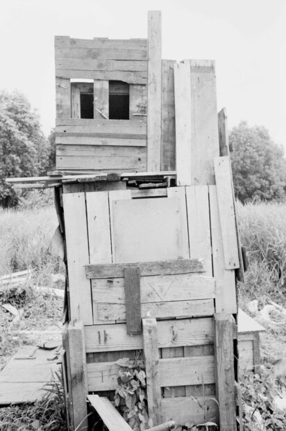 Black and white image of a wood hut