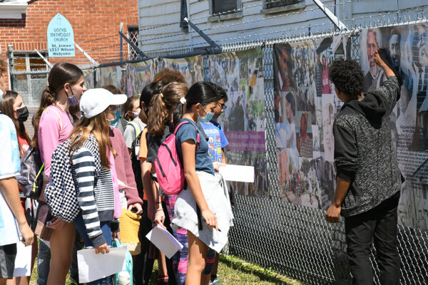 A photograph of Chardona Johnson leading a tour of Freedmen’s Town for Awty International students.
