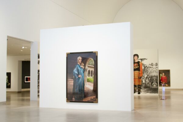 An installation photograph of large-scale self-portrait photographs by Cindy Sherman at the Dallas Museum of Art.