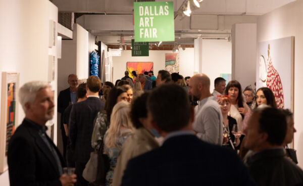 A photograph of a large crowd of people at the Dallas Art Fair.