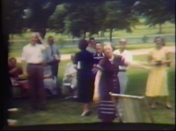 Blurry archival image of the artists family at a family reunion