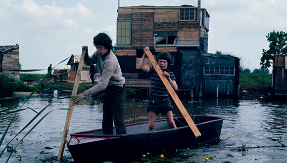 Photo of two boys rowing a boat
