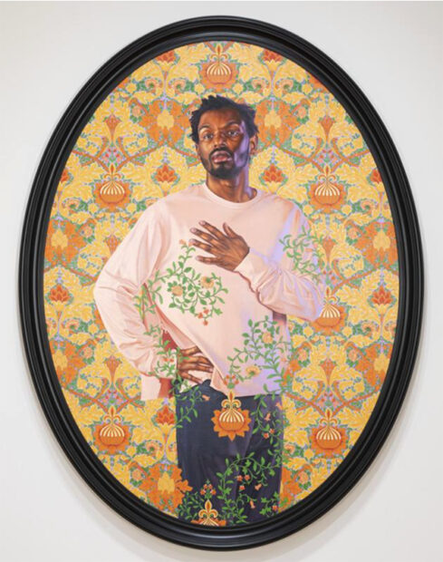 A painting by Kehinde Wiley featuring a Black man standing with his hand on his chest. He is surrounded by an ornately designed background that at times overlaps his portrait.