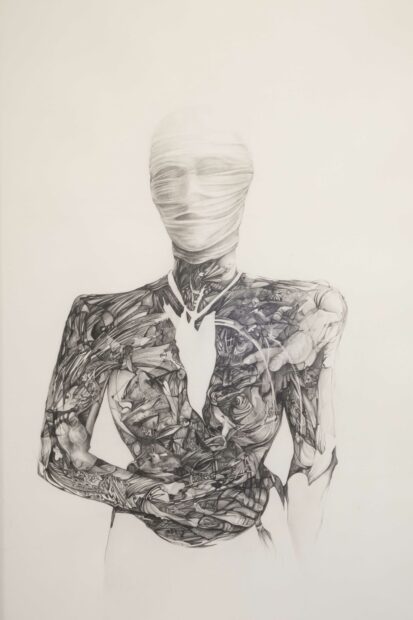 Drawing of a torso with the face covered in bandages