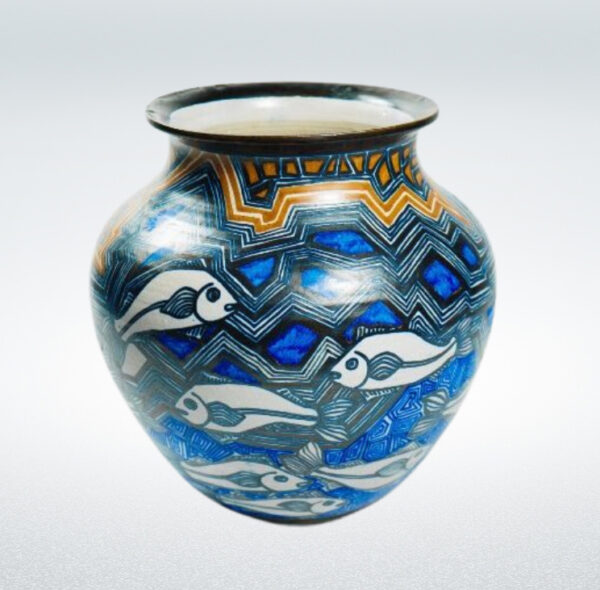 A vase with geometric patterning and abstracted fish on its surface.
