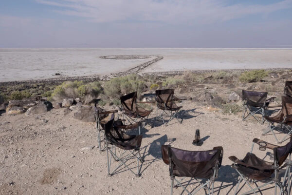 Photo of camping chairs in a circle near Smithson's Spiral Jetty