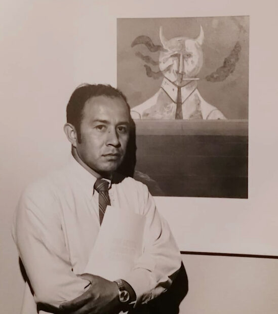 Portrait of the artist standing in front of his painting