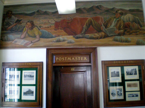 Mural above a Postmaster door depicting people reading in a canyon next to a longhorn