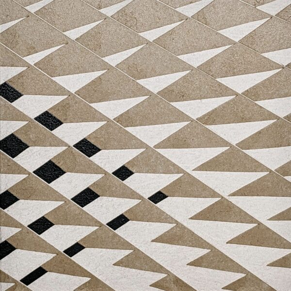 A geometric work featuring diamond shapes in tan, white, and black.