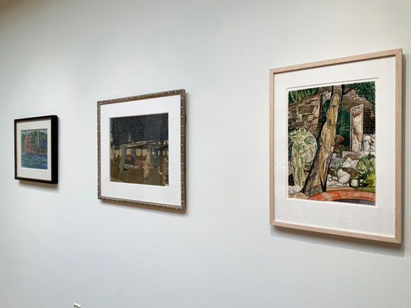 Three artworks hang on a wall.