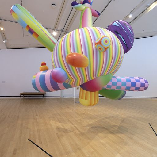A photograph of a large colorful inflatable sculpture by FriendsWithYou.