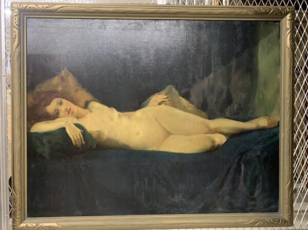 Painting of a nude woman reclining on a couch