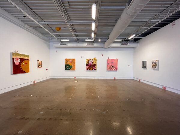 An installation image of paintings and small sculptures by Lauren Walker.