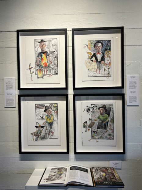 Collection of four drawings hanging in a grid against a white wall
