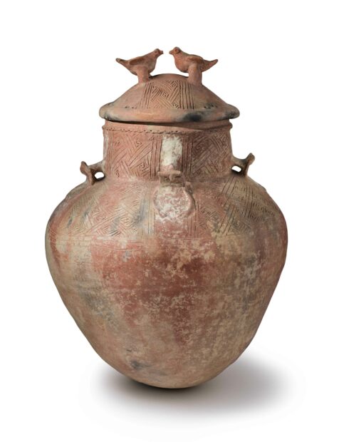 Terra cotta burial urn with two birds on the lid
