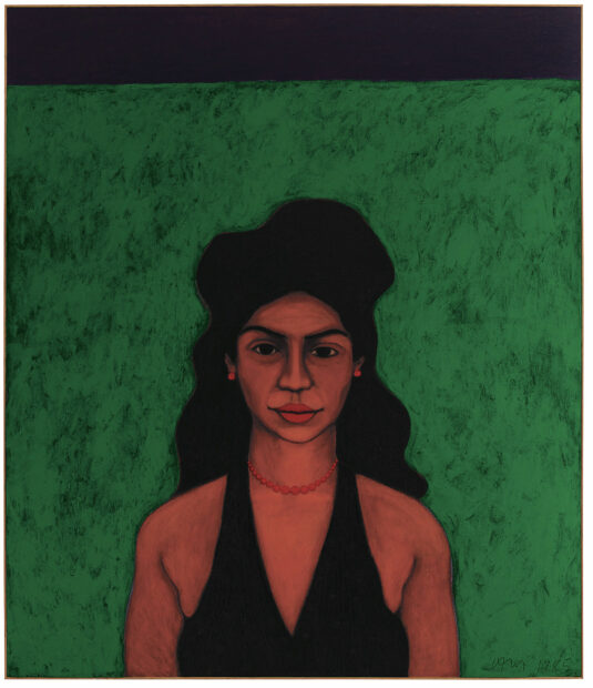 Portrait of a women in front of a green backdrop