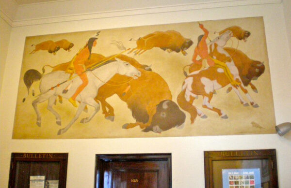 Mural of Native American people hunting a buffalo