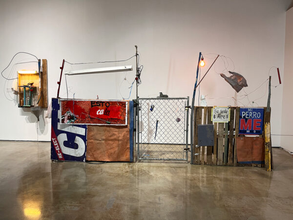 An installation image of two assemblage works by Gil Rocha.