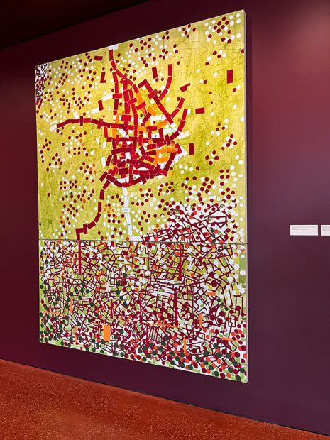 A photograph of a large abstract painting by Rick Lowe on view at Ruby City in San Antonio.