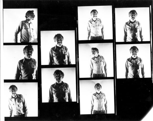 A black and white contact proof print of ten photographs of James Harithas standing in front of a white background.