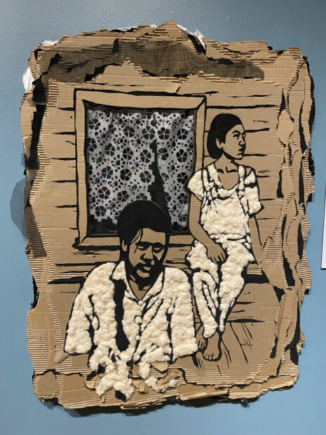 Portrait of two figures cut from cardboard and cotton