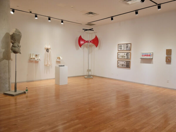 Installation view of two and three dimensional sculptural works on the wall and in the space