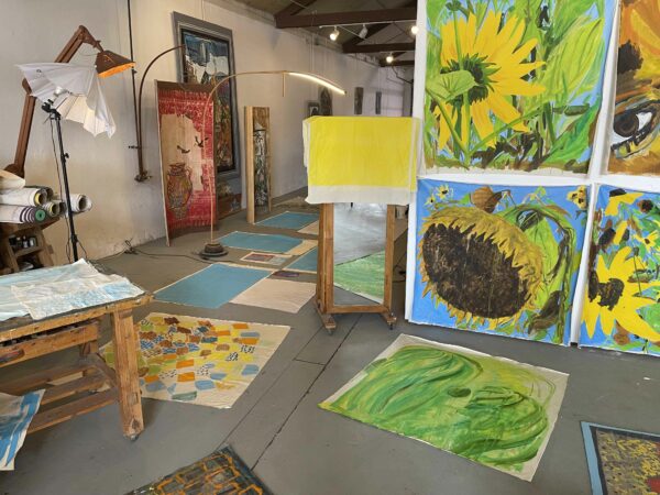 Artists studio space with large sunflower paintings