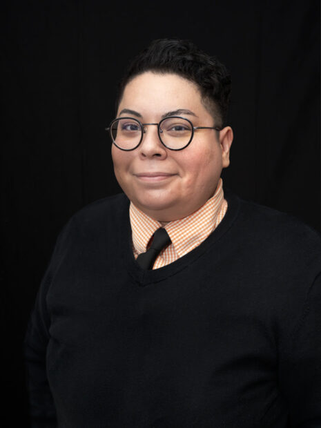 A headshot of curator and scholar Dr. Claudia Zapata.