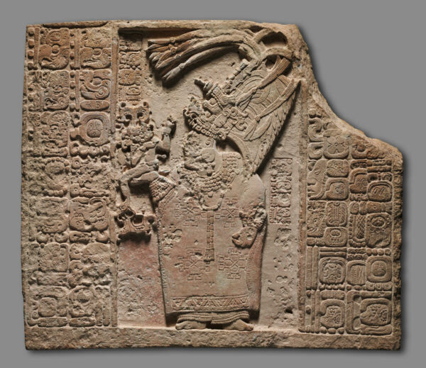 A photograph of a limestone relief sculpted by 8th century Maya artists K’in Lakam Chahk and Jun Nat Omootz. 