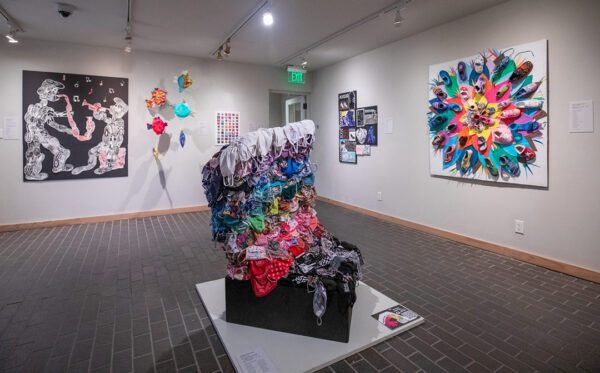 An installation photograph of student works responding to a work by vanessa german.