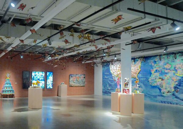 Installation view of works on walls and pedestals
