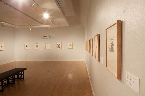 An installation photograph of a 1999 exhibition at the El Paso Museum of Art featuring bilingual exhibition text.