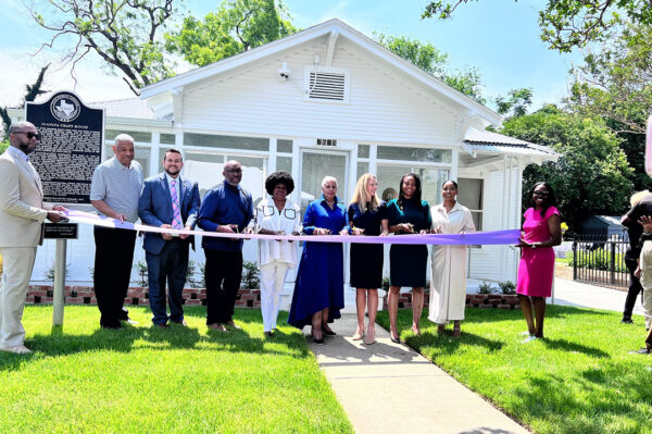 A photograph of a ribbon cutting ceremony at the Juanita J. Craft Civil Rights House and Museum.
