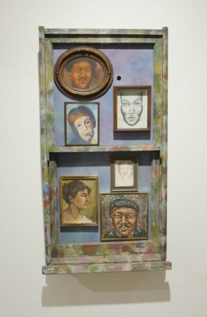 Portraits of family members on a window shaped panel