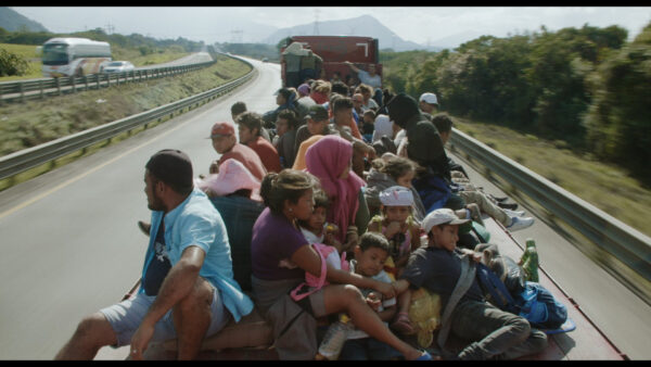 A caravan of people on a truck