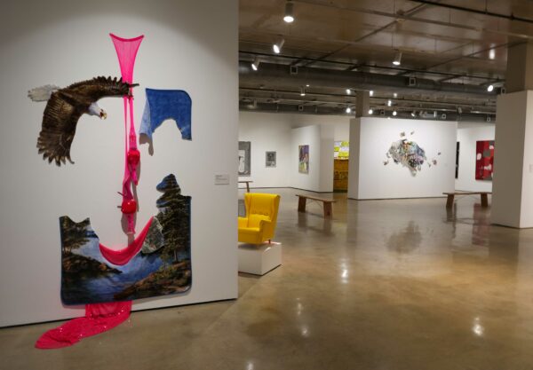 Installation view of sculpture and two dimensional work on walls