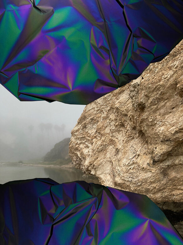 A digital photograph by Darcie Book featuring a heavily textured rock flanked by iridescent material.