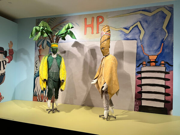 An installation image of two costumes designed by Diego Rivera.