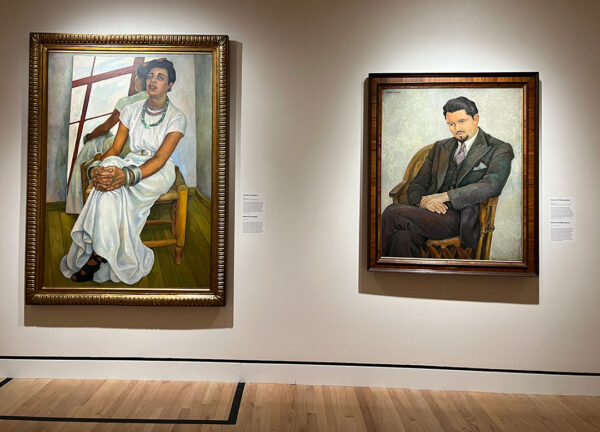 An installation image of two portraits painted by Diego Rivera.