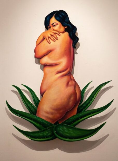 A painting by Josie Del Castillo featuring a nude woman emerging from an agave plant.