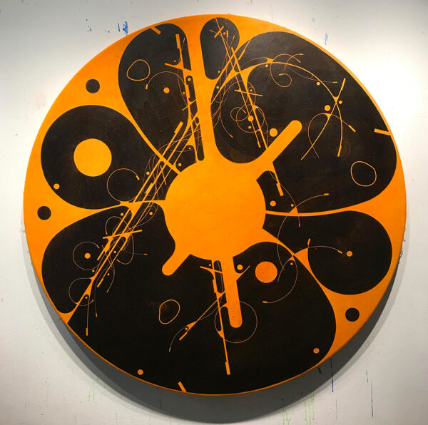 A photograph of an abstract painting on a circle canvas featuring black organic shapes on an orange background.