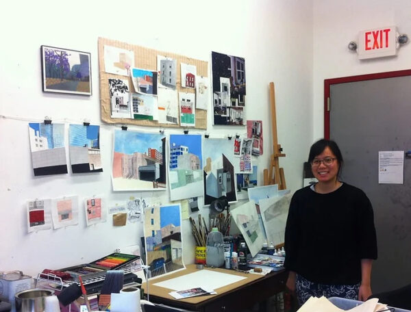 A photograph of artist Naomi Kuo in her studio.