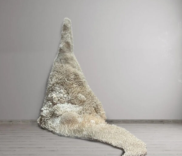 A sprawling porcelain sculpture by Saba Beiser that resembles a mass of bleached corals. 
