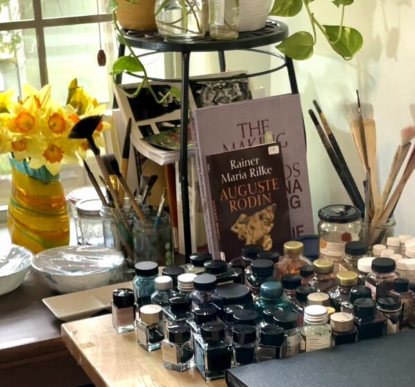 Books and paints in an artists studio